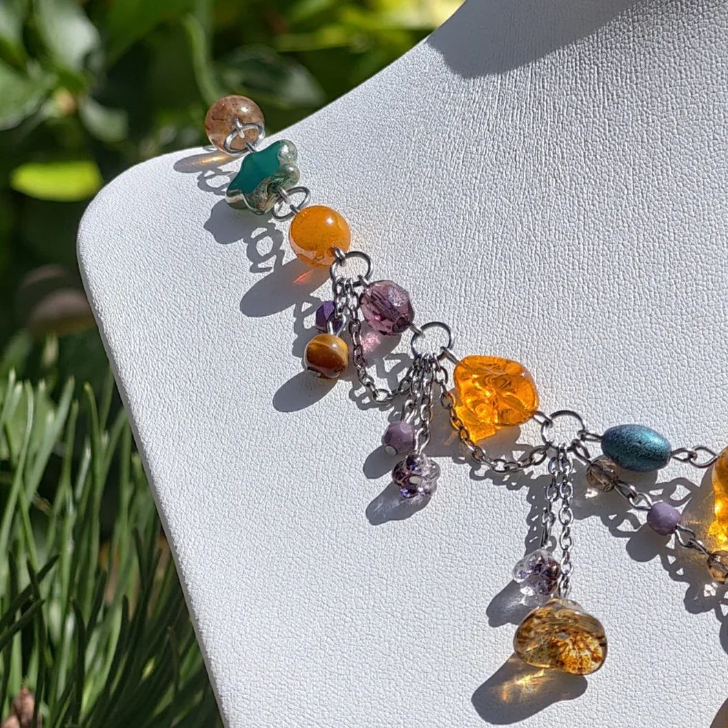 Venus of Willendorf, Fantasy Jewelry,  Handmade jewelry, Whimsical Jewelry, Unique Jewelry.  Royalcore Fairycore Jewelry, Orange and brown, side